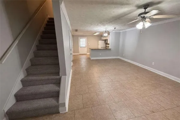a view of staircase and white walls