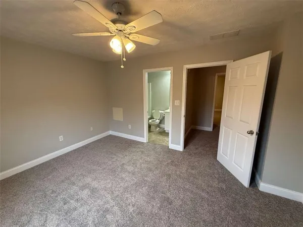 an empty room with a bathroom
