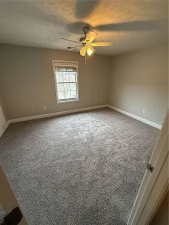 a view of a livingroom with a fan