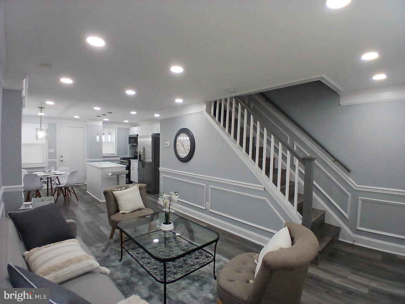 300 Denison Street Baltimore, MD 21229 - Photo 13 of 25 a living room with furniture and a wooden floor