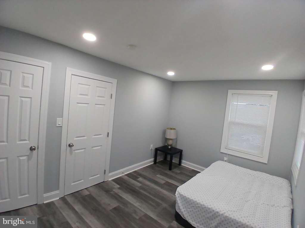 300 Denison Street Baltimore, MD 21229 - Photo 15 of 25 a bedroom with a bed and a window