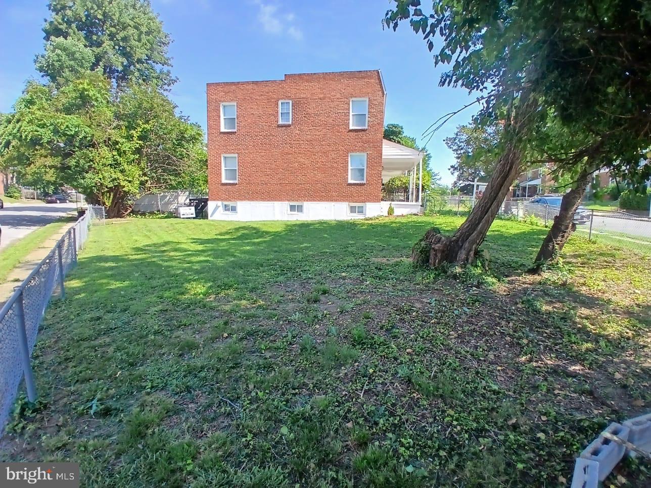 300 Denison Street Baltimore, MD 21229 - Photo 25 of 25 a view of a house with a yard