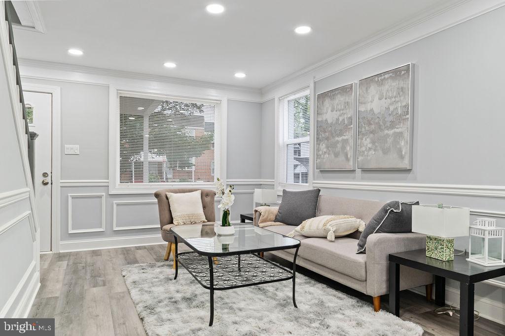 300 Denison Street Baltimore, MD 21229 - Photo 7 of 25 a living room with furniture and a large window