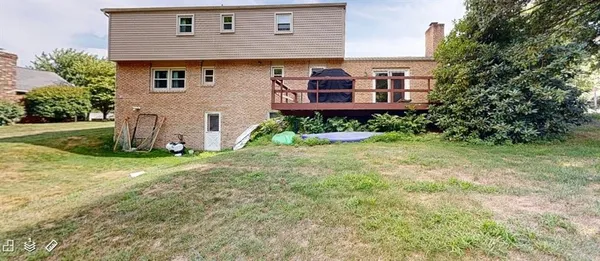 a view of a house with a yard and plants