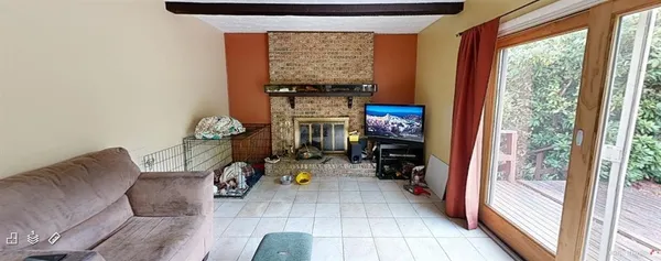a living room with furniture and a window