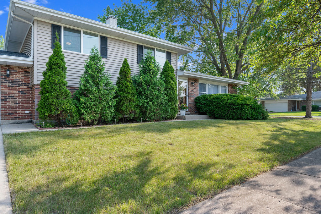 537 West Stearns Road Bartlett, IL 60103 - Photo 1 of 30 a front view of house with yard and green space
