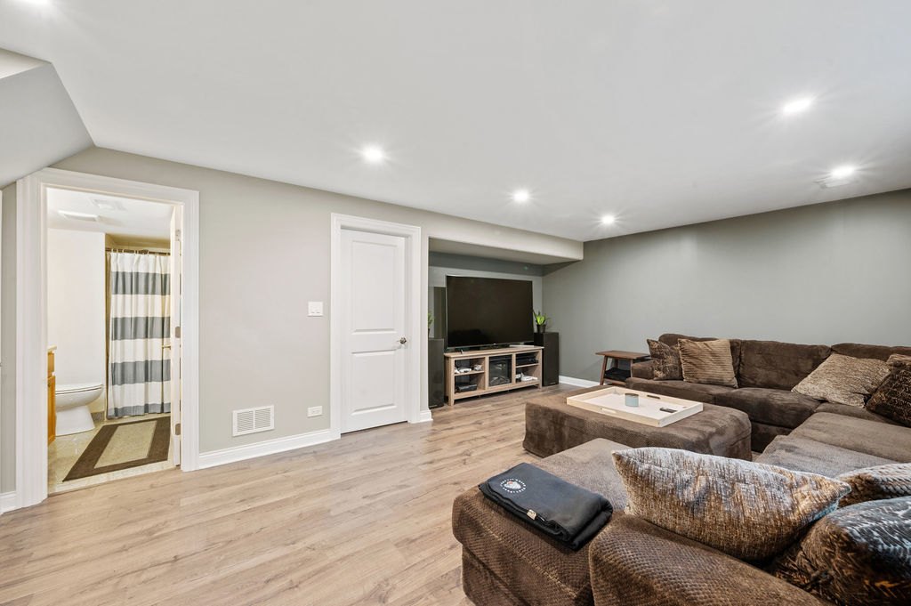 537 West Stearns Road Bartlett, IL 60103 - Photo 15 of 30 a living room with furniture and a flat screen tv