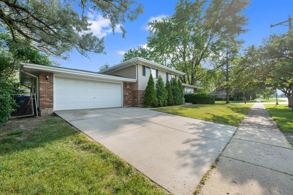 537 West Stearns Road Bartlett, IL 60103 - Photo 27 of 30 a front view of a house with a yard and trees