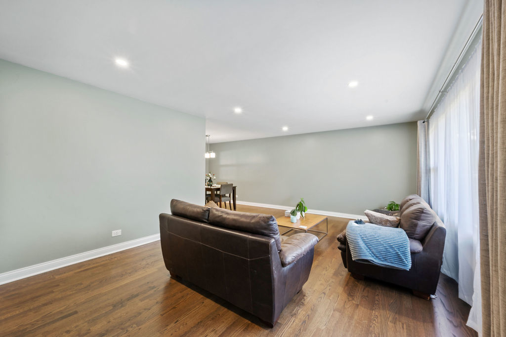 537 West Stearns Road Bartlett, IL 60103 - Photo 5 of 30 a living room with furniture and a wooden floor
