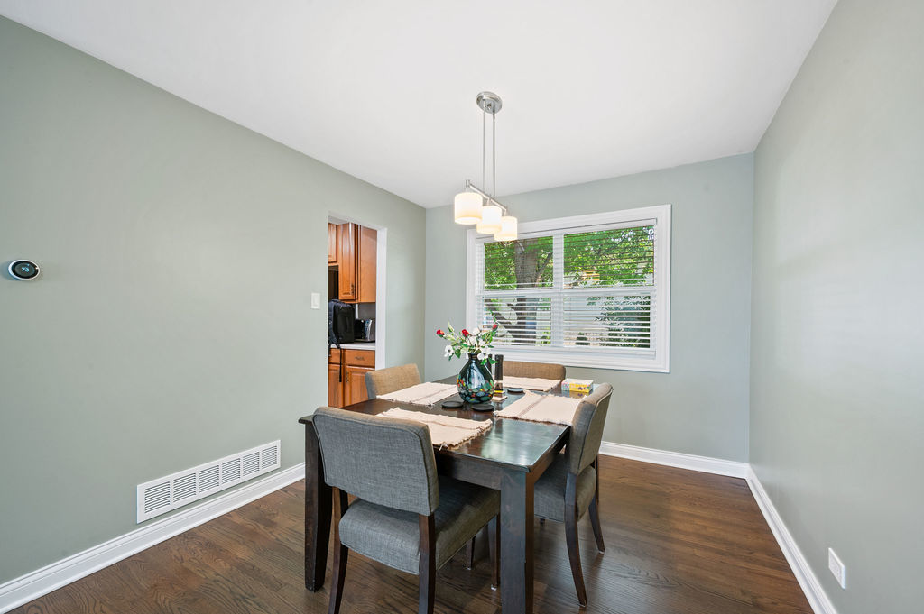 537 West Stearns Road Bartlett, IL 60103 - Photo 8 of 30 a dining room with furniture window wooden floor