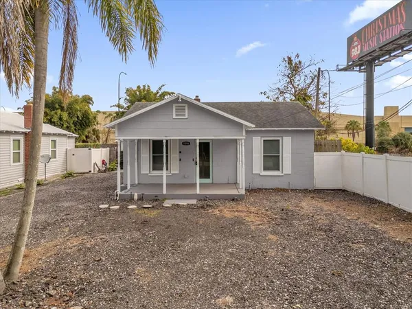 a view of a house with a wooden deck