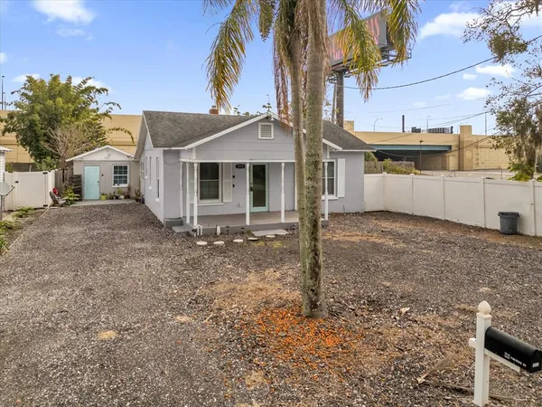 a view of a lake with couches in the patio