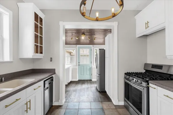 a kitchen with a stove and a sink