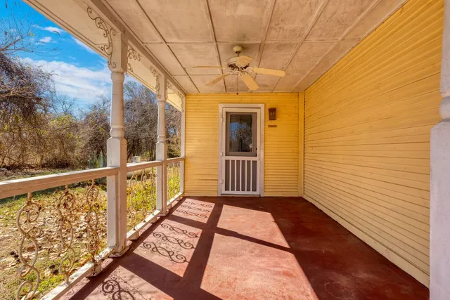a view of a balcony with wooden floor