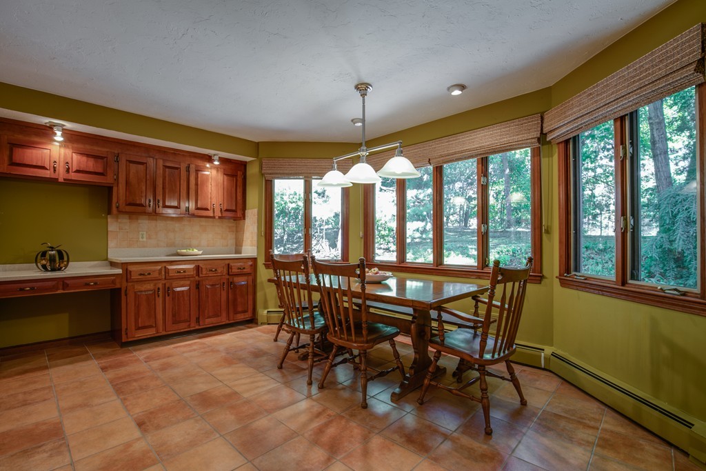 63 Monadnock Road Wellesley, MA 02481 - Photo 11 of 30 a view of a dining room with furniture window and outside view