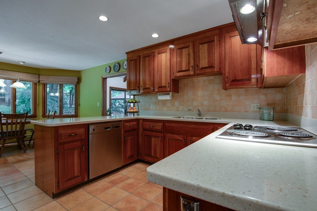 63 Monadnock Road Wellesley, MA 02481 - Photo 15 of 30 a kitchen with a sink a stove cabinets and a window