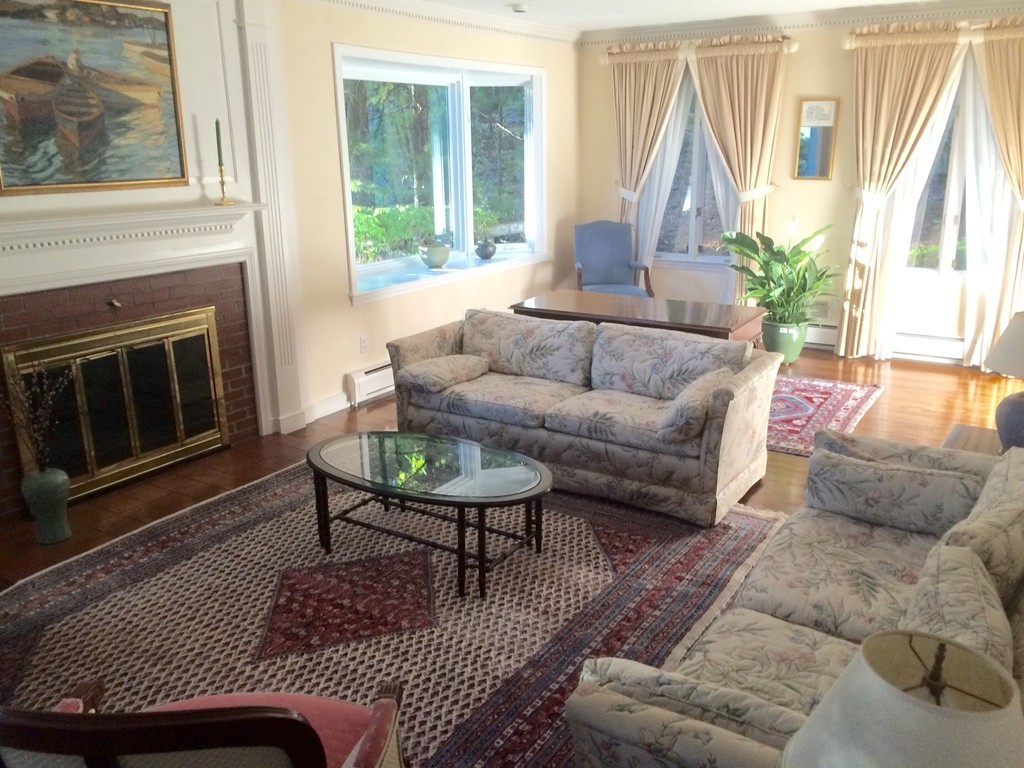 63 Monadnock Road Wellesley, MA 02481 - Photo 18 of 30 a living room with furniture and a fireplace