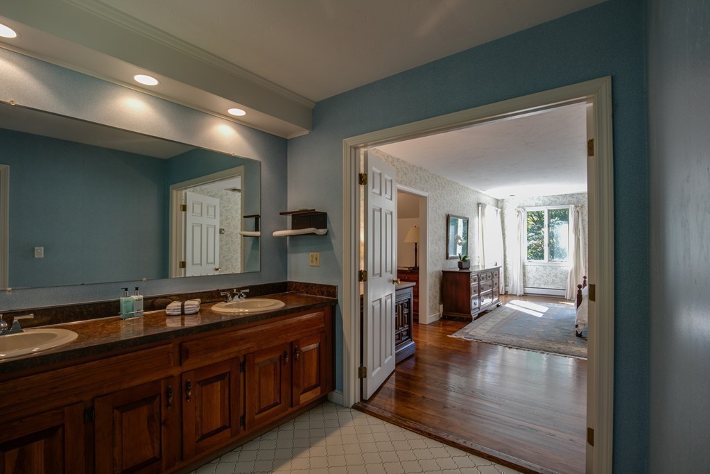 63 Monadnock Road Wellesley, MA 02481 - Photo 21 of 30 a bathroom with a sink and a mirror