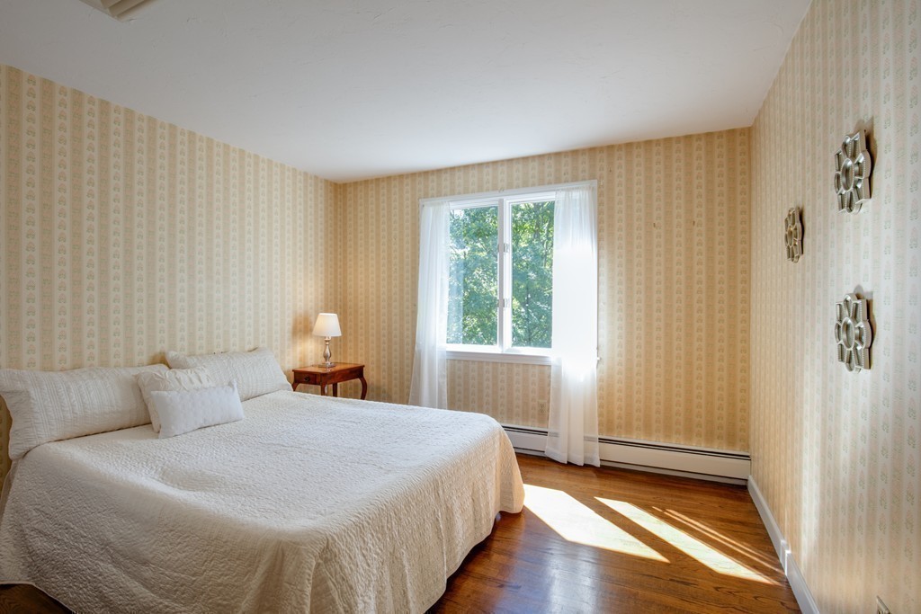 63 Monadnock Road Wellesley, MA 02481 - Photo 26 of 30 a bedroom with a bed and a window