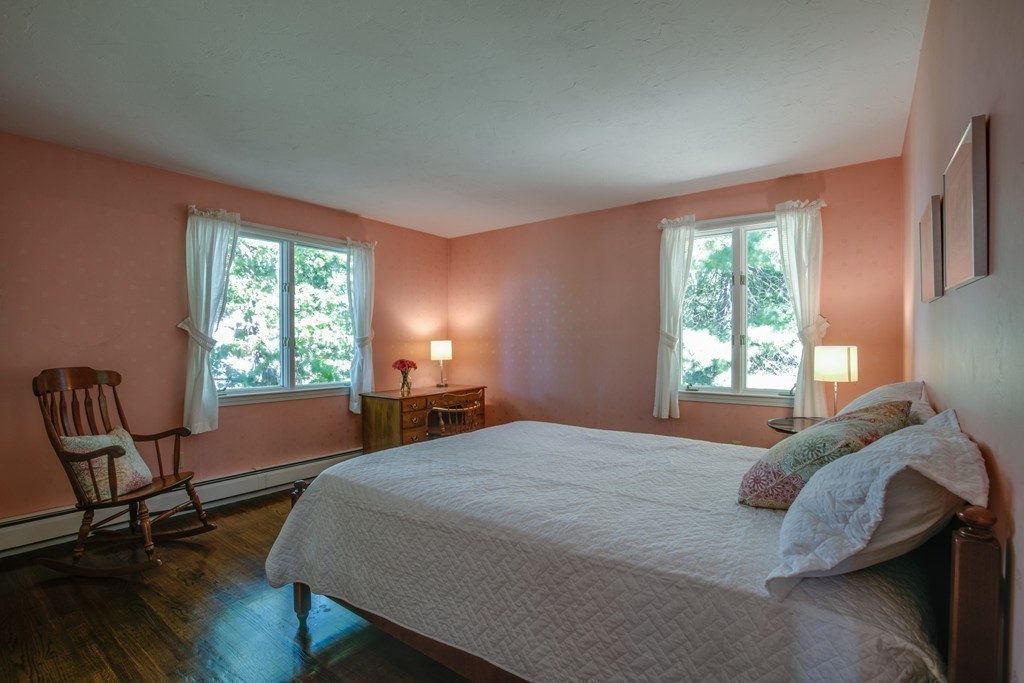63 Monadnock Road Wellesley, MA 02481 - Photo 27 of 30 a bedroom with a bed chair and a window