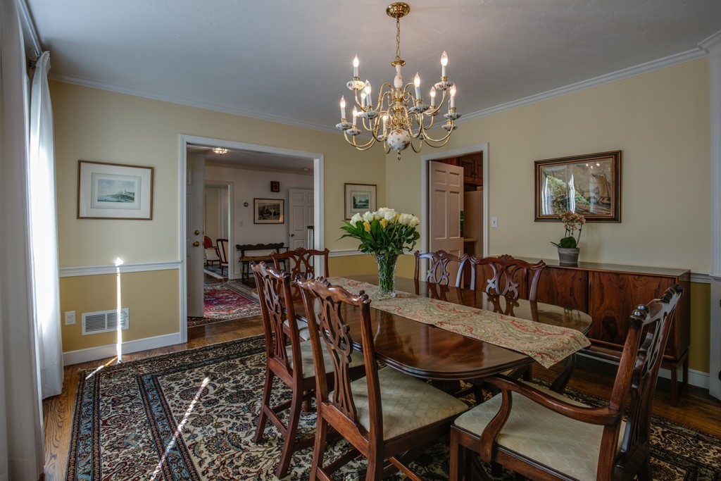 63 Monadnock Road Wellesley, MA 02481 - Photo 7 of 30 a view of a dining room with furniture and chandelier