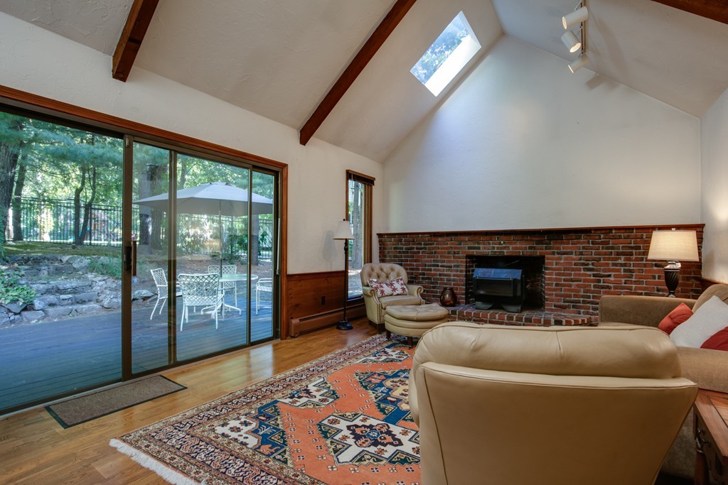 63 Monadnock Road Wellesley, MA 02481 - Photo 9 of 30 a living room with furniture and a fireplace