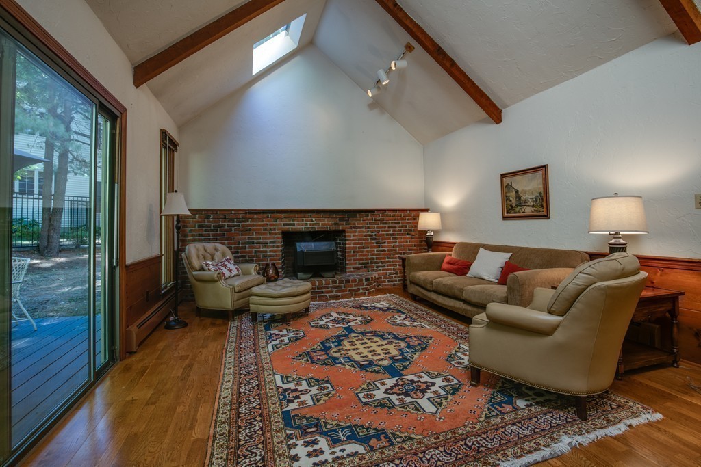 63 Monadnock Road Wellesley, MA 02481 - Photo 10 of 30 a living room with furniture and a fireplace