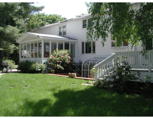 20 Maple Road Wellesley, MA 02481 - Photo 3 of 9 a front view of house with a garden and patio
