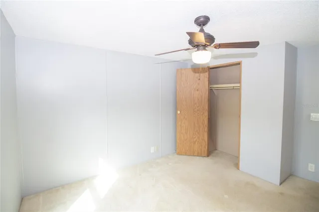 a view of a chandelier fan in a room
