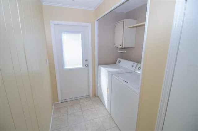 a utility room with a sink a washer and dryer