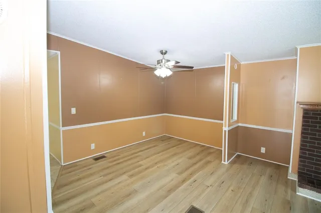 a view of a livingroom with wooden floor