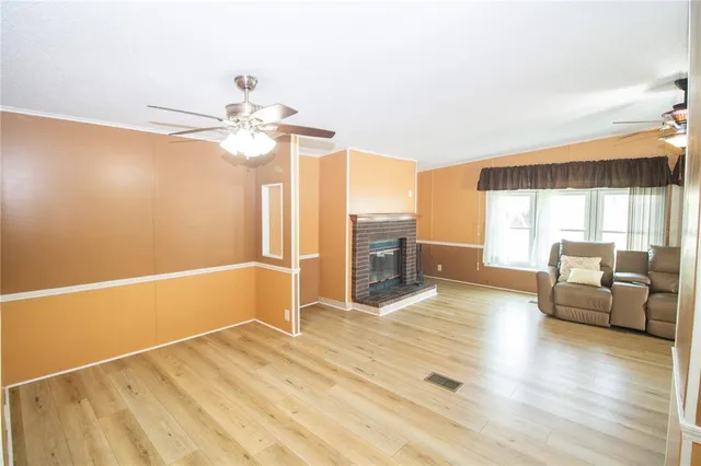 a view of livingroom with hardwood floor and ceiling fan