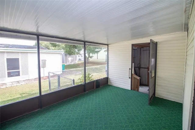 a view of an empty room with a large window