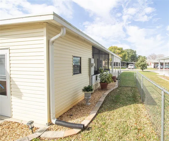 a view of a backyard of the house