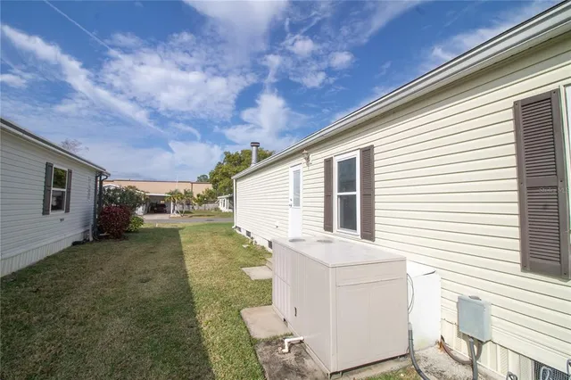 a view of a backyard with furniture and a backyard