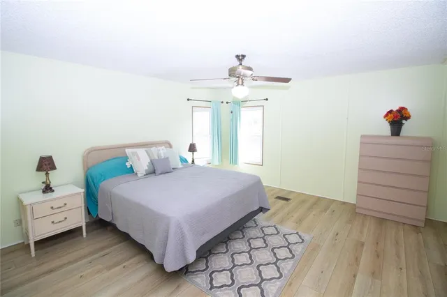 a bedroom with a bed and a dresser