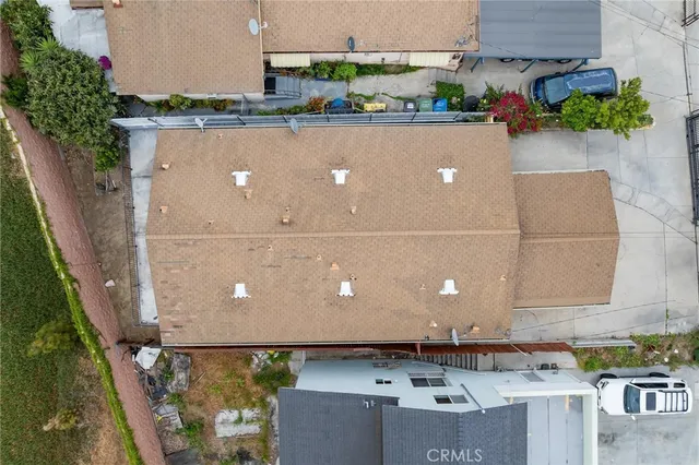 a kitchen with granite countertop white cabinets and stainless steel appliances