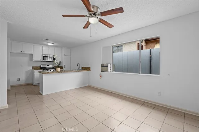 a view of an empty room and bathroom