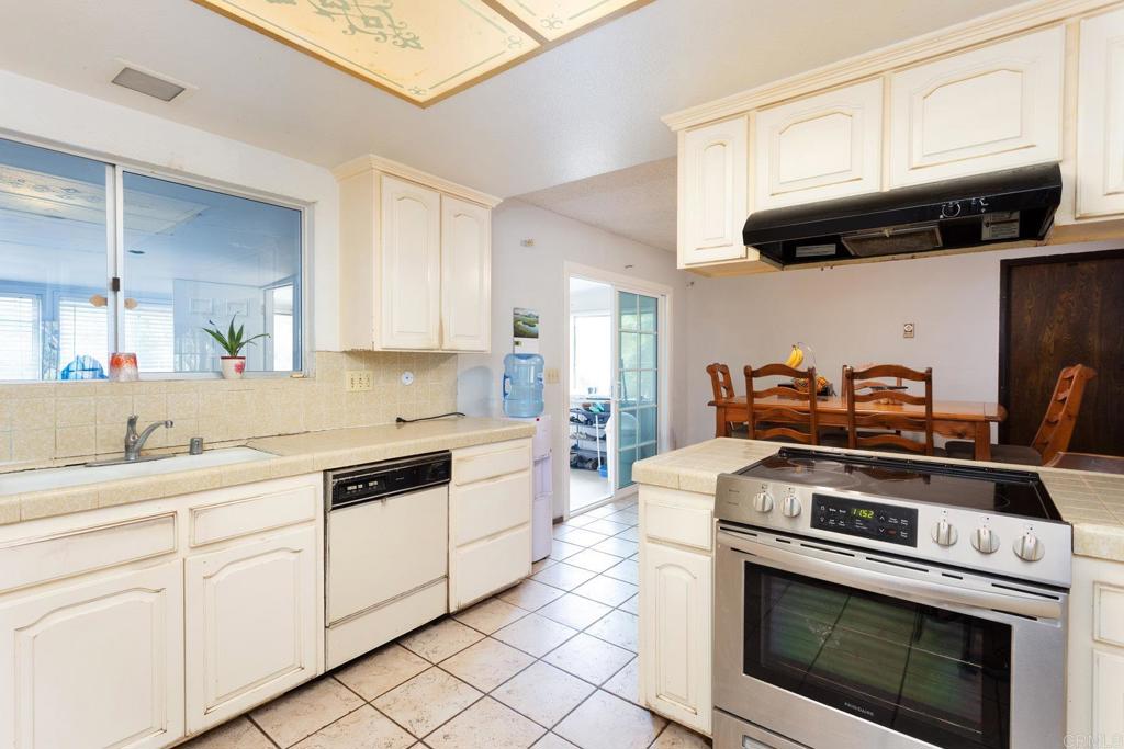 436 Mason Road Vista, CA 92084 - Photo 11 of 32 a kitchen with cabinets and appliances