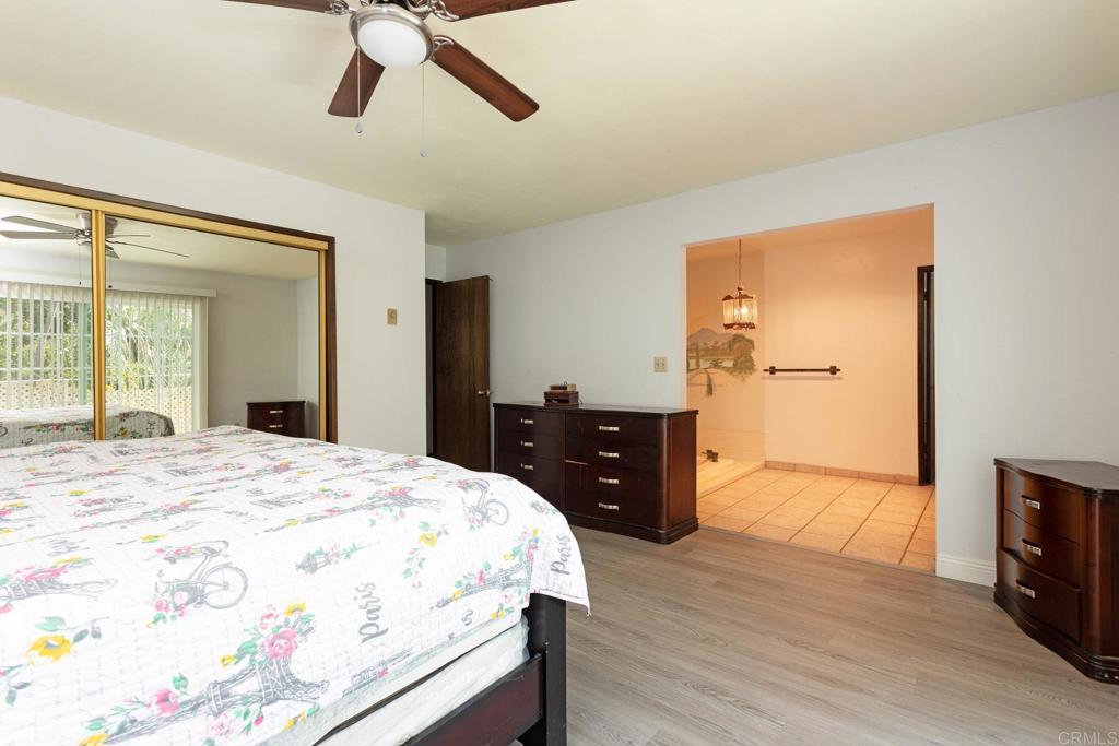 436 Mason Road Vista, CA 92084 - Photo 16 of 32 a bedroom with a bed and wooden floor