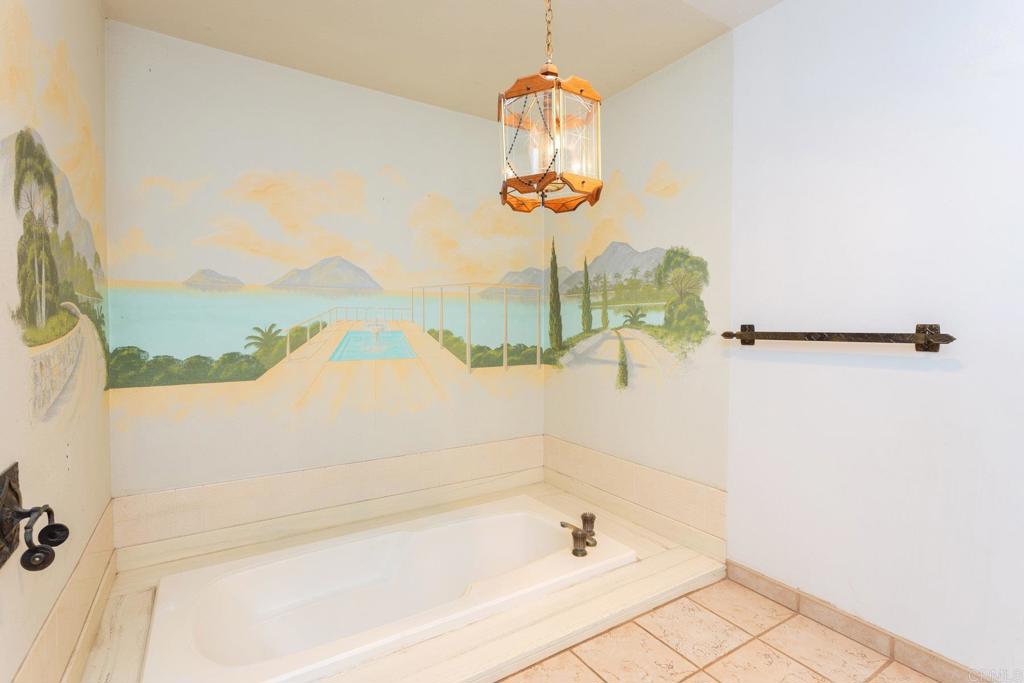 436 Mason Road Vista, CA 92084 - Photo 17 of 32 a bathroom with a bathtub and shower