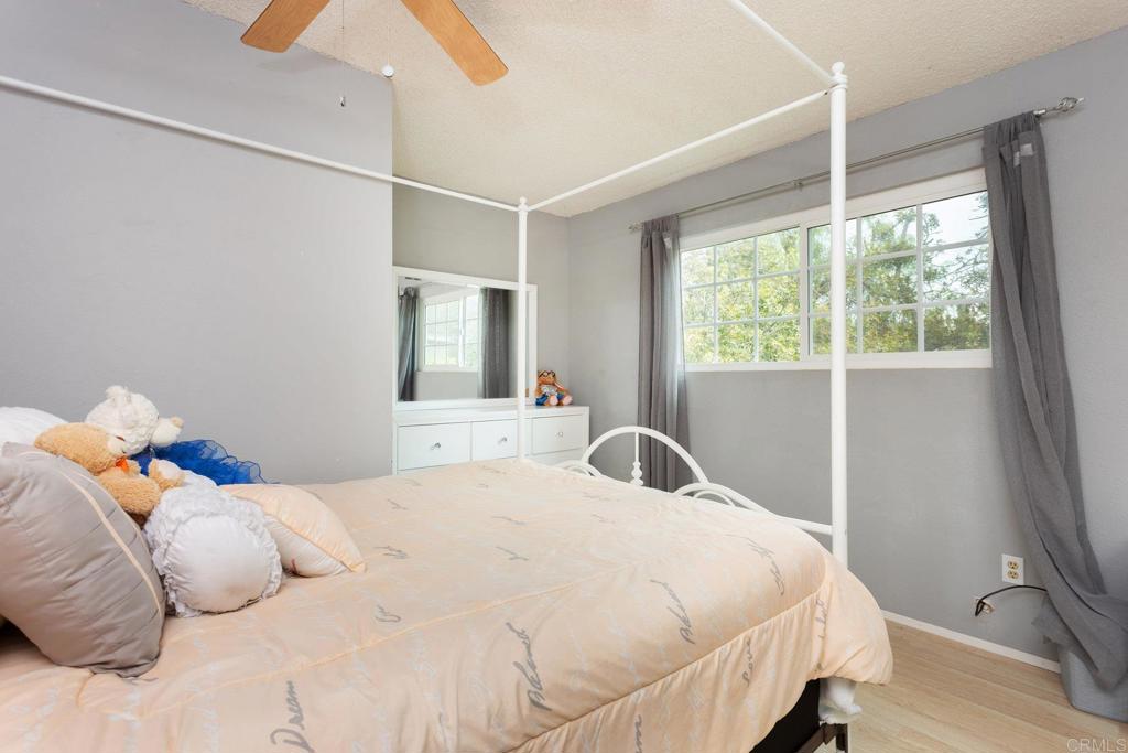 436 Mason Road Vista, CA 92084 - Photo 20 of 32 a bedroom with a large bed and a window