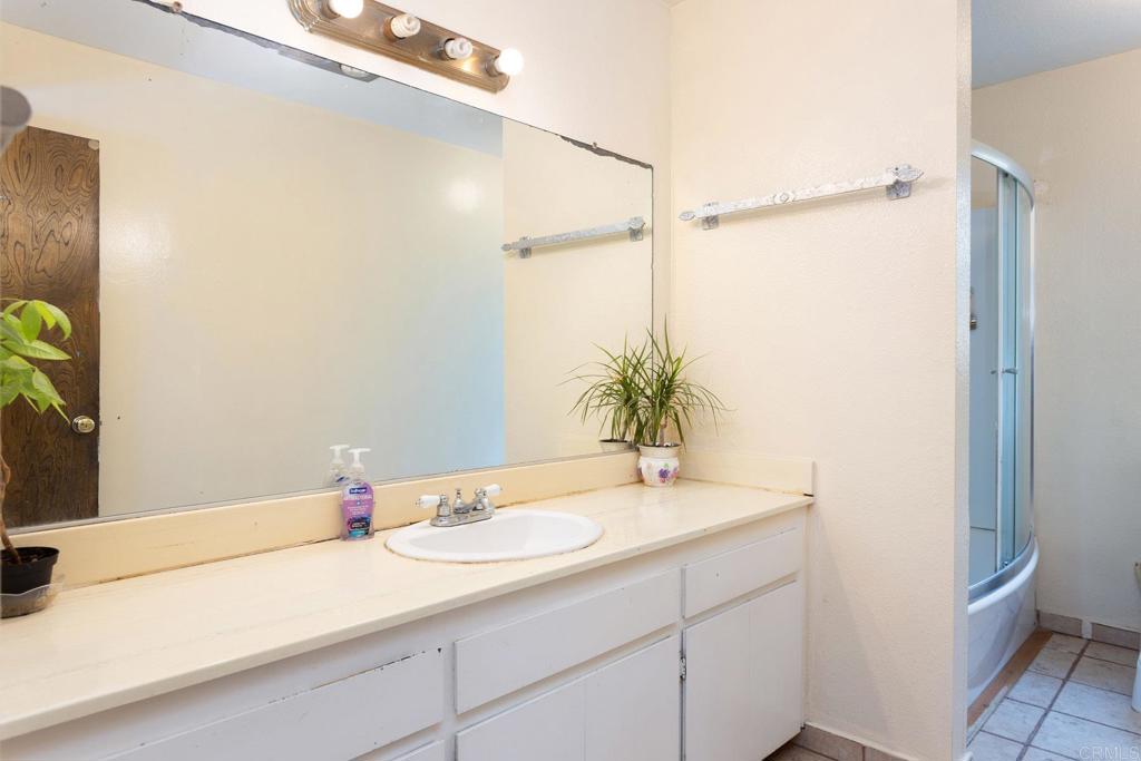 436 Mason Road Vista, CA 92084 - Photo 21 of 32 a bathroom with a sink and a mirror