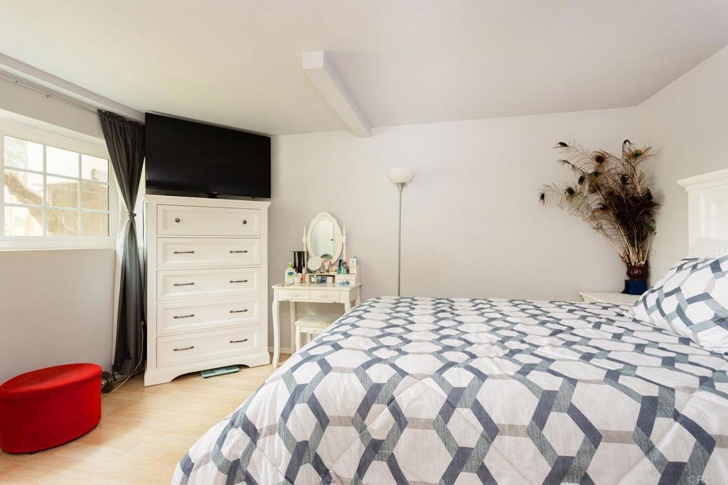 436 Mason Road Vista, CA 92084 - Photo 22 of 32 a bedroom with a bed television and a window