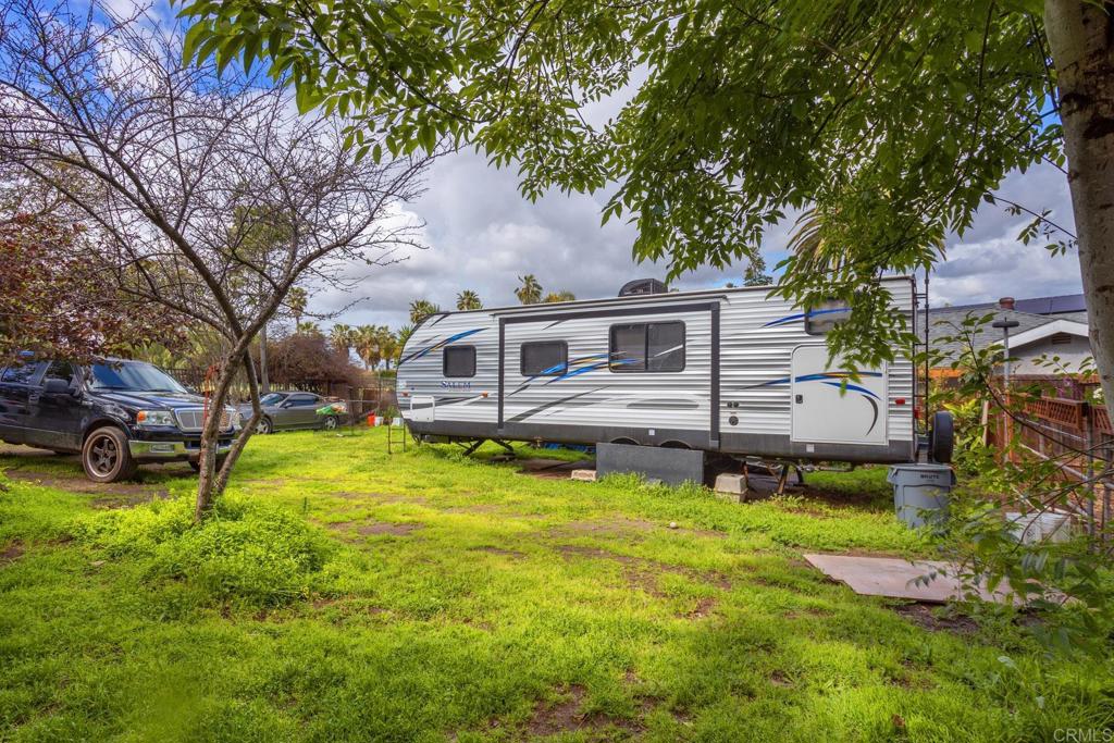 436 Mason Road Vista, CA 92084 - Photo 32 of 32 a view of a house with a big yard potted plants and large tree