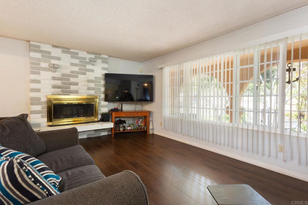 436 Mason Road Vista, CA 92084 - Photo 8 of 32 a living room with furniture and a flat screen tv