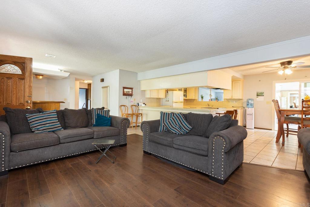 436 Mason Road Vista, CA 92084 - Photo 9 of 32 a living room with furniture and a large window