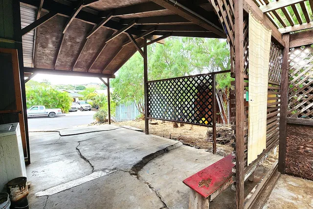 a view of a backyard with a sink and glass door