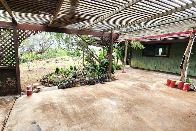 a view of a chairs and table in the patio