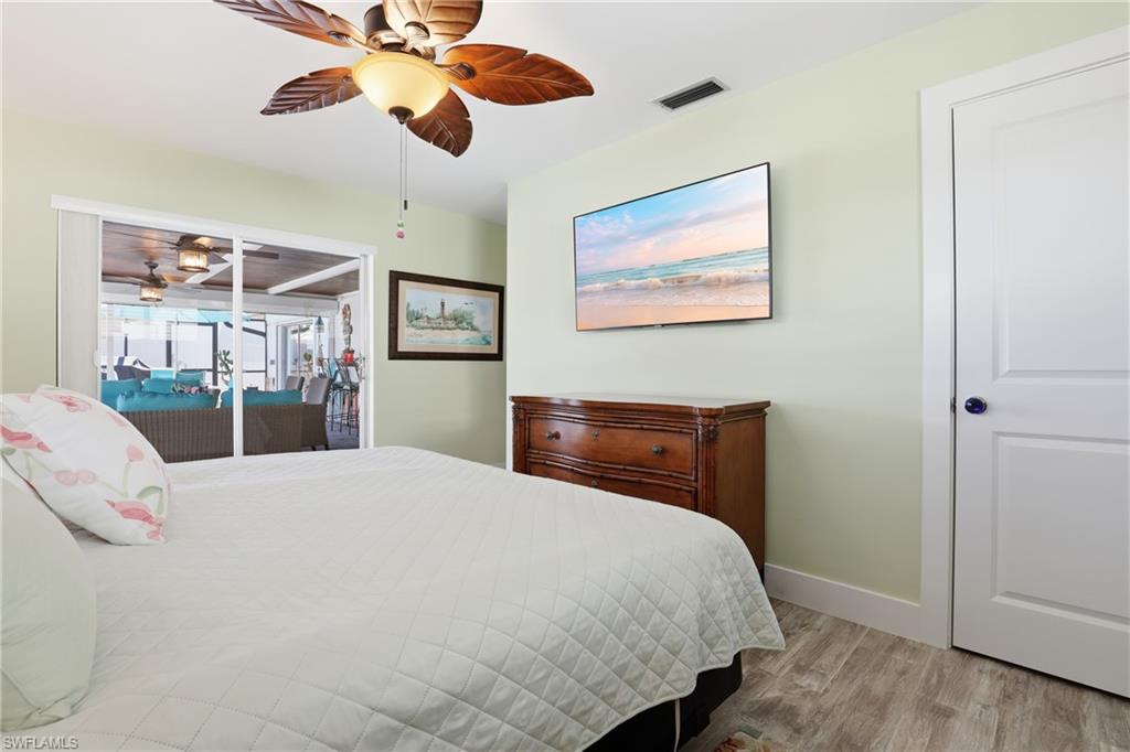 17 Palmview Boulevard Fort Myers Beach, FL 33931 - Photo 16 of 36 a bedroom with a bed and a dresser